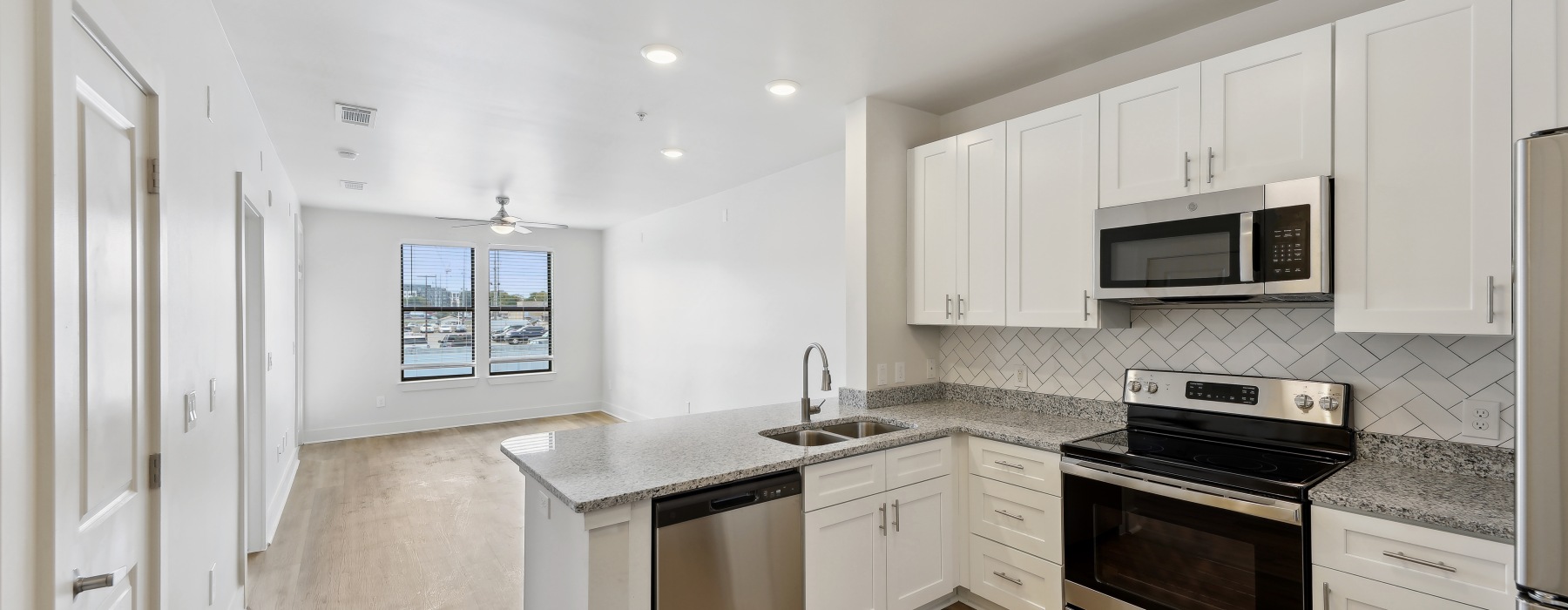 kitchen with white cabinetry and stainless appliances